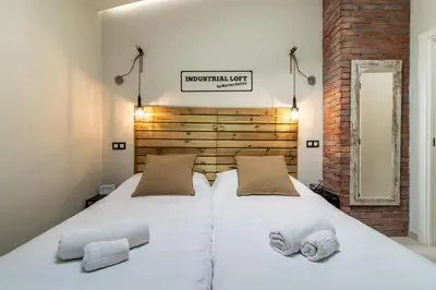 Cama o camas de una habitación en Apartamentos Marina Suites