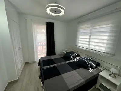 Cama o camas de una habitación en MODERN DUPLEX 50m FROM THE BEACH