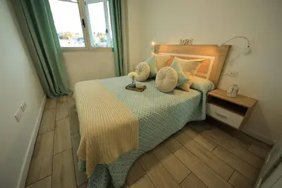 Cama o camas de una habitación en Las Palmeras in Playa La Garita - beach apartment
