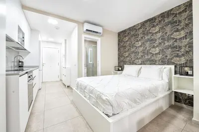 Cama o camas de una habitación en City and Beach Home, Las Canteras