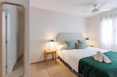 Cama o camas de una habitación en Apartamento en el barrio de Triana V76