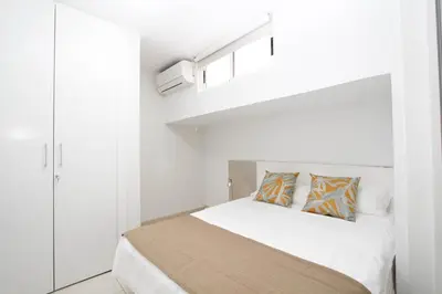 Cama o camas de una habitación en Casa grande familiar con 4 terrazas