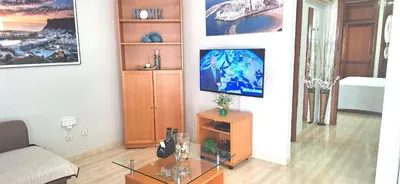 Una televisión o centro de entretenimiento en Apartamento La Marisma Playa de Mogán
