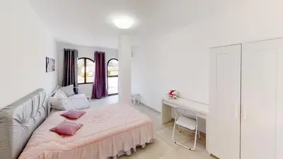 Cama o camas de una habitación en VV Las Buganvillas MASPALOMAS - Cocina y habitaciones con baños privados