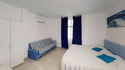 Cama o camas de una habitación en VV Las Buganvillas MASPALOMAS - Cocina y habitaciones con baños privados