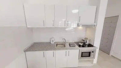 Una cocina o zona de cocina en VV Las Buganvillas MASPALOMAS - Cocina y habitaciones con baños privados