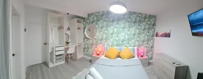 Una televisión o centro de entretenimiento en Apartamento Playa Chica