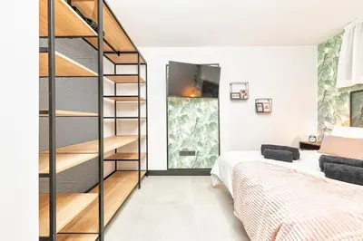 Cama o camas de una habitación en Airbnb cerca de la playa