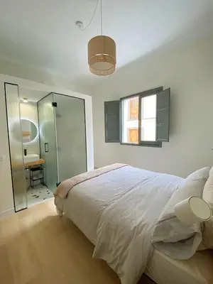 Cama o camas de una habitación en La Puebla Rooms