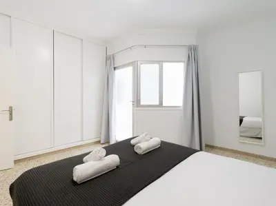 Cama o camas de una habitación en Beach Front Las Canteras By CanariasGetaway