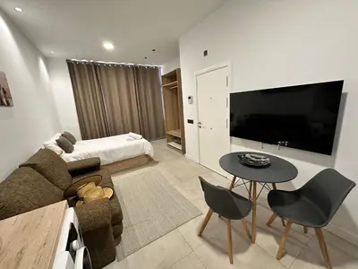 Una televisión o centro de entretenimiento en Mirador Suites