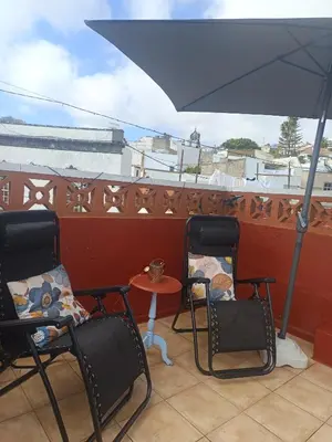 Un balcón o terraza de Acoran's Family Ocean view guest house in North Gran Canaria with daily yoga included peaceful atmosphere trekking and pet friendly stay