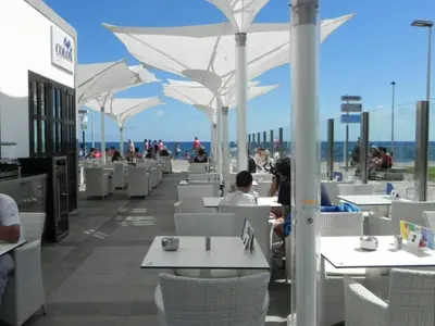 Un restaurante o sitio para comer en Belvilla by OYO Meloneras Bahia 7