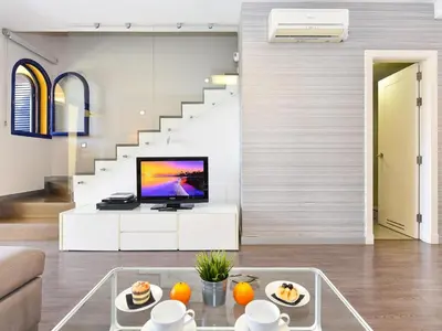 Una televisión o centro de entretenimiento en Belvilla by OYO Meloneras Bahia 7
