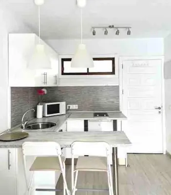 Una cocina o zona de cocina en Blue Harmony Apartment