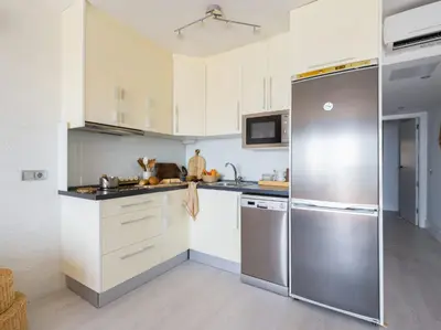 Una cocina o zona de cocina en Apartamento Primera Línea de Playa