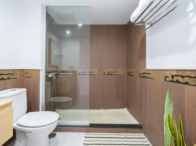 Un baño de Apartamento Primera Línea de Playa