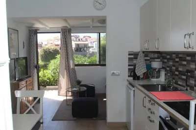 Una cocina o zona de cocina en Bungalow in the heart of Arguineguín