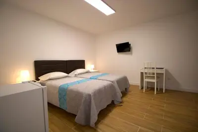 Cama o camas de una habitación en Las Palmas Smart Rooms