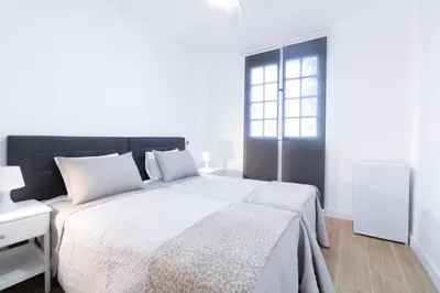 Cama o camas de una habitación en Las Palmas Smart Rooms