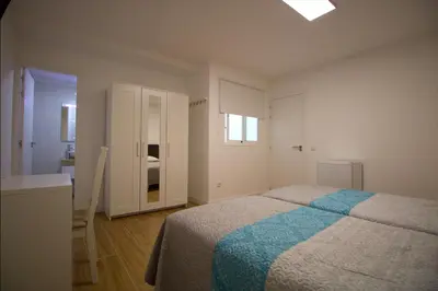 Cama o camas de una habitación en Las Palmas Smart Rooms
