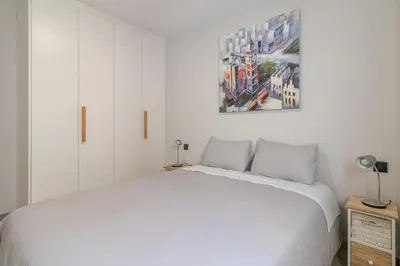 Cama o camas de una habitación en Flatguest Urban Haven