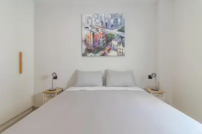 Cama o camas de una habitación en Flatguest Urban Haven