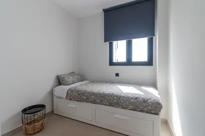 Cama o camas de una habitación en Flatguest Urban Haven