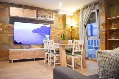 Una televisión o centro de entretenimiento en La Puntilla Deluxe Apartment