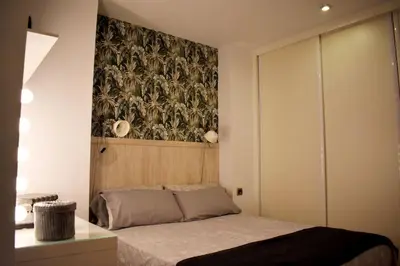 Cama o camas de una habitación en La Puntilla Deluxe Apartment