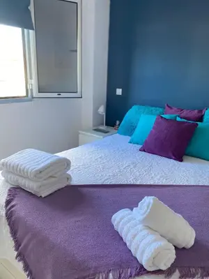 Cama o camas de una habitación en Vistas Mar Playa Las Canteras primera línea Wifi