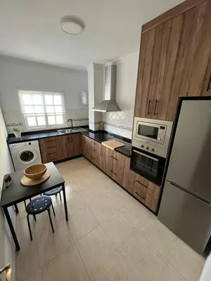 Una cocina o zona de cocina en NIVARIA SUITE