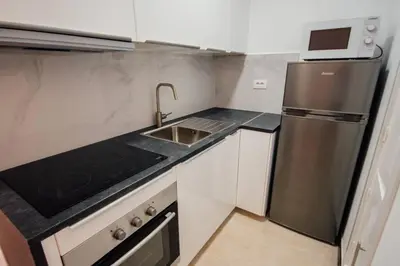 Una cocina o zona de cocina en Cozy apartment Playa del Inglés 47