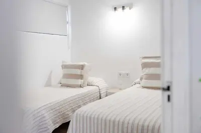 Cama o camas de una habitación en Deluxe Los Porches - by Gestión Vacacional Canarias