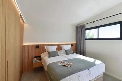 Cama o camas de una habitación en Los Canarios 630 by VillaGranCanaria