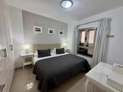 Cama o camas de una habitación en COSTA AZUL APARTMENTS -1A