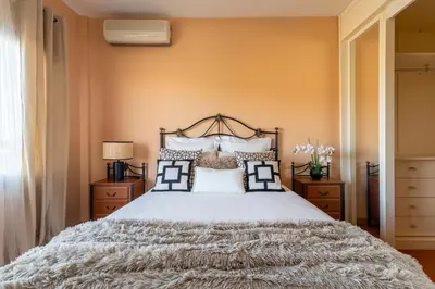 Cama o camas de una habitación en Bellavista Aeropuerto
