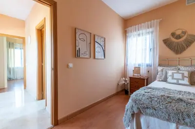 Cama o camas de una habitación en Bellavista Aeropuerto