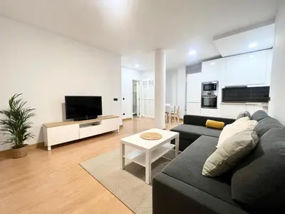Una televisión o centro de entretenimiento en Sea lover Home