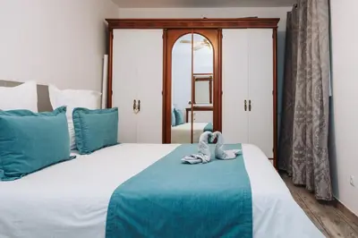 Cama o camas de una habitación en Beachfront Apartment incl highspeed WIFI