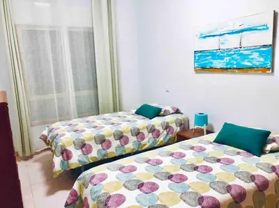 Cama o camas de una habitación en Casa playa Las Canteras