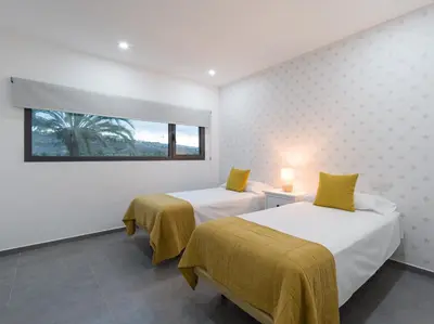 Cama o camas de una habitación en Salobre Golf Villas Tabaibas