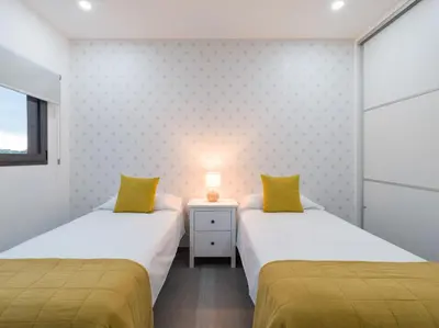 Cama o camas de una habitación en Salobre Golf Villas Tabaibas