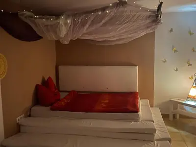 Cama o camas de una habitación en Flor de Loto Tantra Xtreme