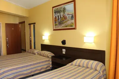 Cama o camas de una habitación en Hotel Olympia