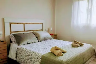 Cama o camas de una habitación en La Palmera 311 by CASAS COCODRILO