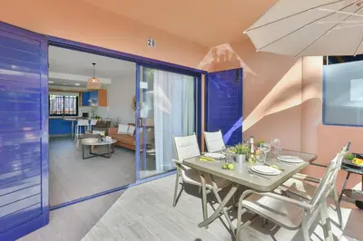 Una televisión o centro de entretenimiento en Meloneras Bahia 28 by VillaGranCanaria
