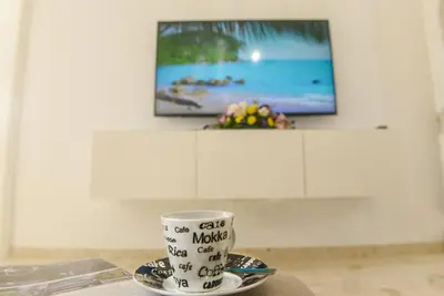 Una televisión o centro de entretenimiento en FAMILY VILLA Playa del Inglés by Canary Vacation Villas