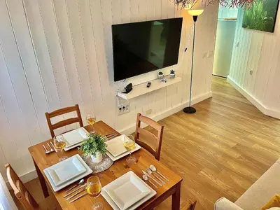 Una televisión o centro de entretenimiento en Las Brisas 1 by SunHousescanarias
