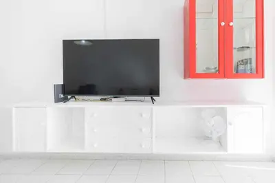 Una televisión o centro de entretenimiento en Sunny Vacations Gran Canaria
